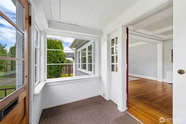 An enclosed front porch to get in out of the elements as you welcome your guests into your home.