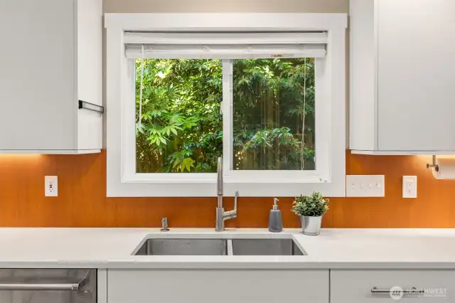 Tranquil views of the back yard and pond water feature will keep you calm while washing dishes