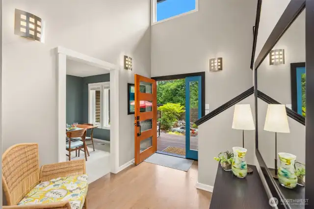 Cheery foyer lets light in from glass paneled front door and huge picture window.