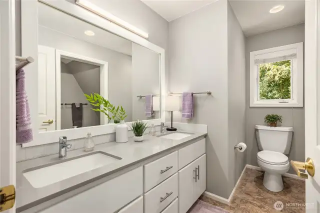 Full upstairs bathroom with quartz counters with dual sinks, and a separate room with a shower