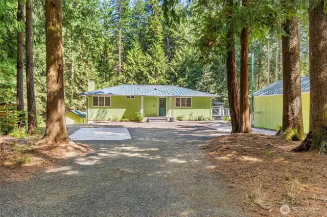 Your approach from Banner Road... Beautifully updated one story with daylight basement and a deck from the South side to full width deck on the East side for maximum morning sunshine! All buildings have METAL Roofing!
