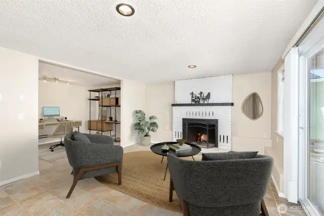 Lower level family room with access to the 2 car attached garage and 3/4 Bath.  Could easily be a home office with its own exterior access and lower parking area! Heated Flooring too!