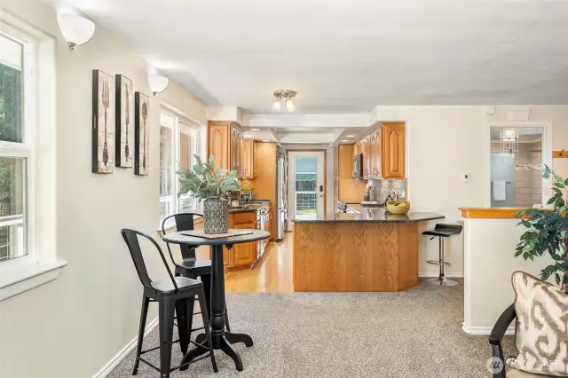 Breakfast bar fits 3 chairs for those quick meals with dining table area near the living room.