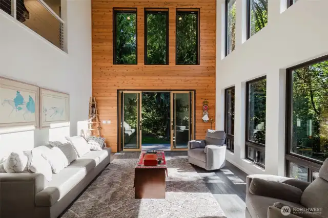 Tucked in a wooded setting, this unique two-story blends privacy with intense disign!