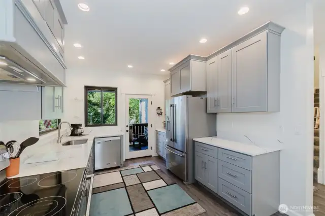 Plenty of counter space and cabinets make daily chores a pleasure! The stainless steel appliances all stay!