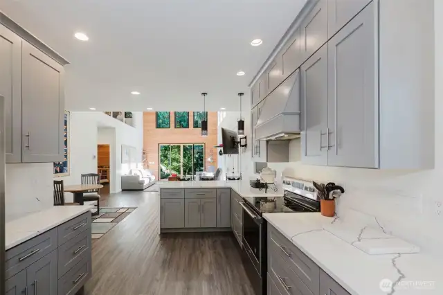 Your warm & inviting kitchen is perfect for staying connected with your guests while you are putting dinner together. Plenty of counter space, cabinets and stainless-steel appliances and undermount sink! The cabinetry has self-closing hinges and drawers. Quartz countertops complete the Perfection!