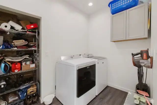 Laundry Room with built in Pantry shelves.