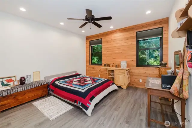 Primary bedroom - love the wood wall!
