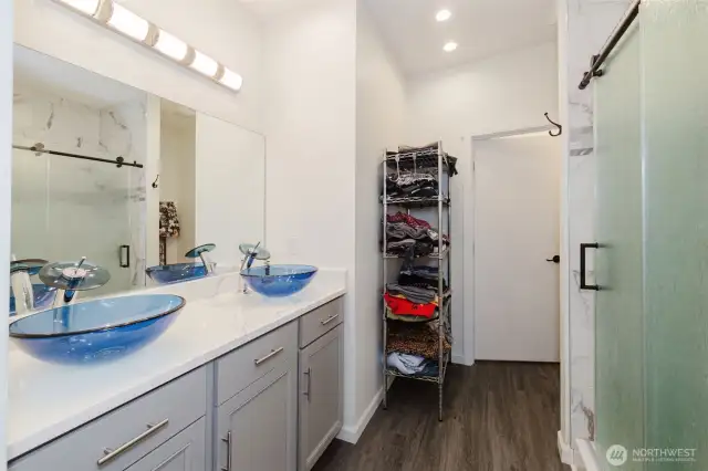 Primary bath with two glass sinks