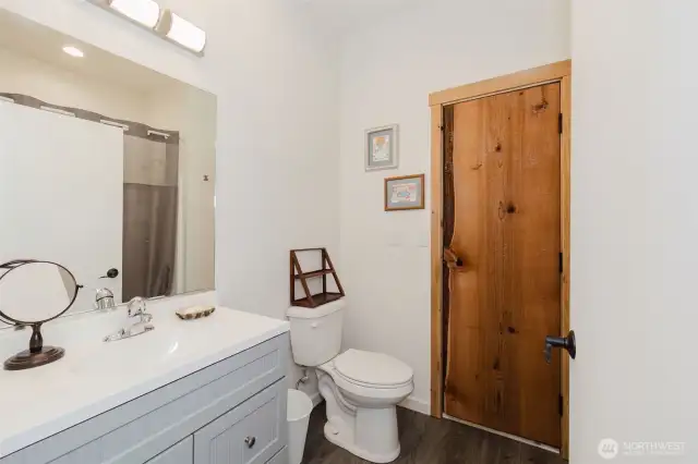 Upper bath with a wood walled sauna through the hand crafted wood door!