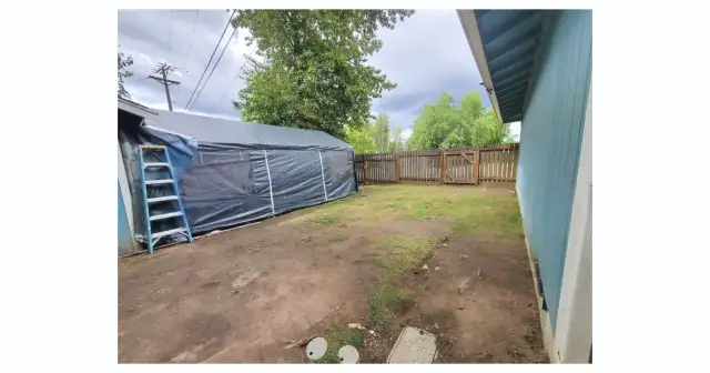 Unit 1104 fully fenced side yard. Tent goes with the tenant.