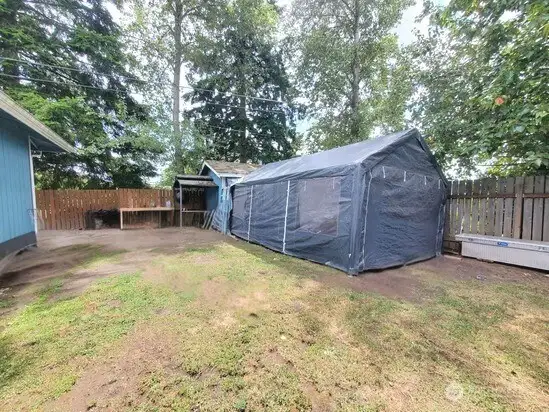 Unit 1104 fully fenced back and side yard. Tent goes with tenant.