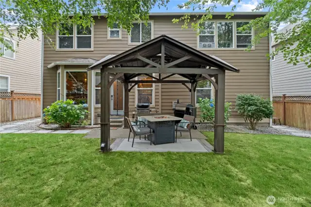 Tranquil Backyard Space with Gazebo and Firepit