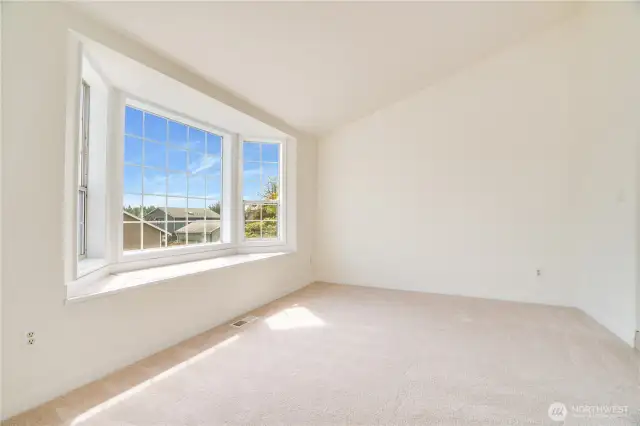 New carpet, paint and trim in this room make it feel large and a great spot to visit with guests and catch up on life.