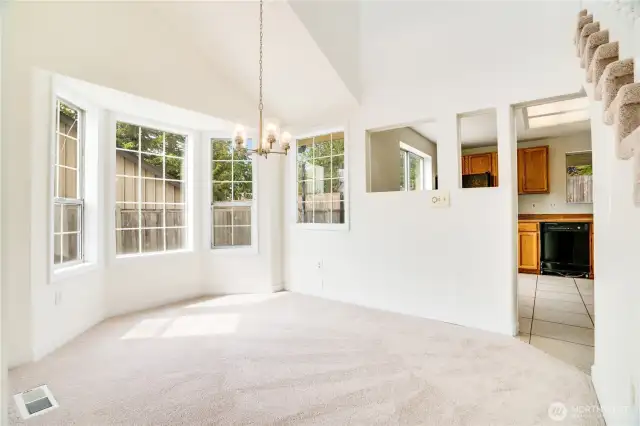 Seat a crowd or enjoy a solo meal in this formal dining space complete with new carpet, trim and paint. Note how easy this room flows to and from the kitchen.