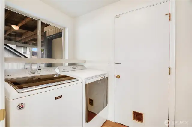 The laundry room leads into the garage and there is a deep sink and storage on the other side just outside of this view. The washer/dryer stay!