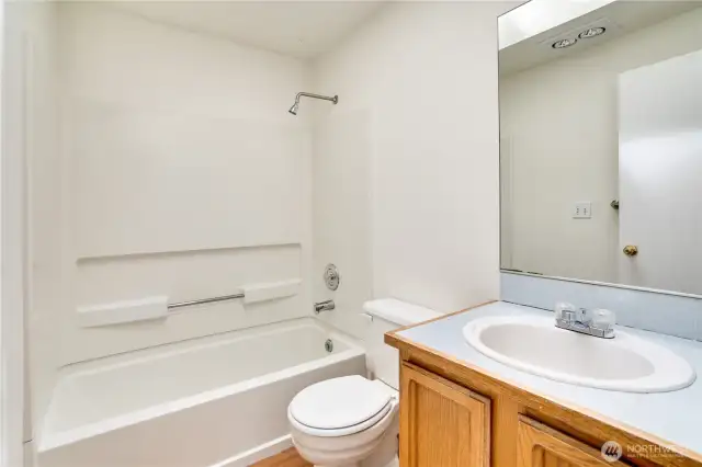 Across from the 2 upstairs bedrooms is the full bath with new LVP flooring and paint!