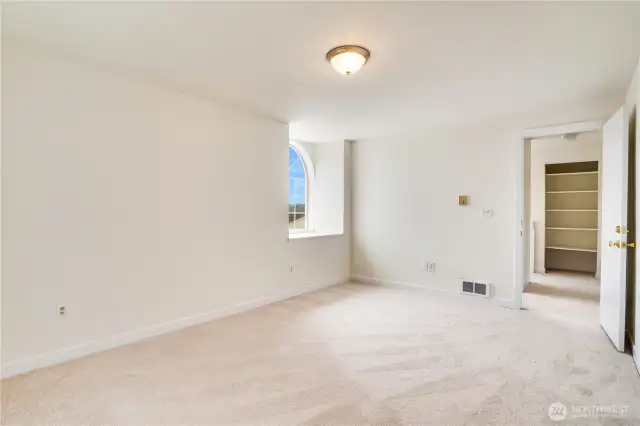 You could easily fit a king bed along with all your dressers a cozy chair for reading in this room. Down the hall is another linen storage closet.