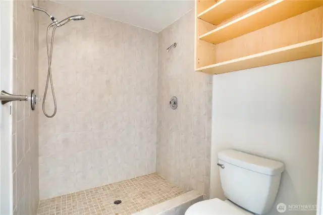 The tiled shower in the primary ensuite has dual shower heads to create a truly spa-like experience!
