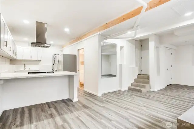This photo shows the entrance to the main home garage just up those stairs. This added finished space is a fantastic opportunity for the next owner of this lovely home.