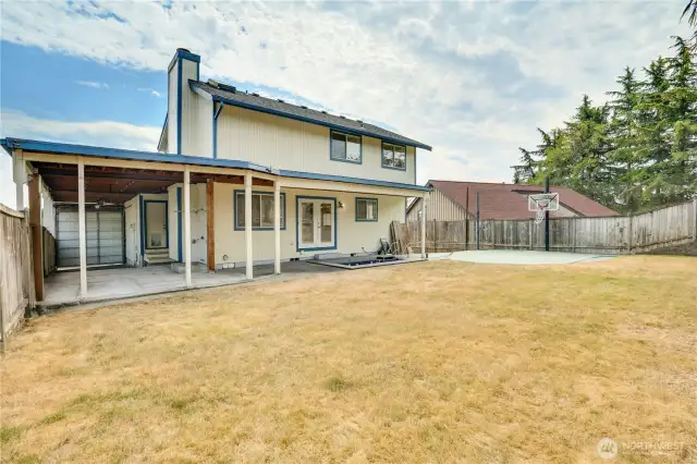 The covered patio provides year-round escape from the elements. Keep the barbecue out and utilize it rain or shine! There is also an in-ground hot tub if that's more your style!