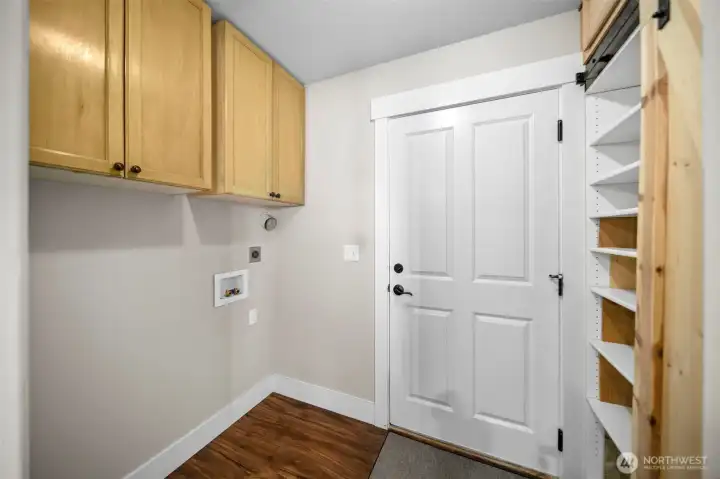 Laundry room with additional storage