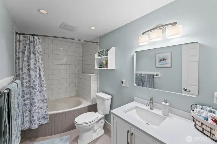 Fully renovated bathroom with soaker tub.