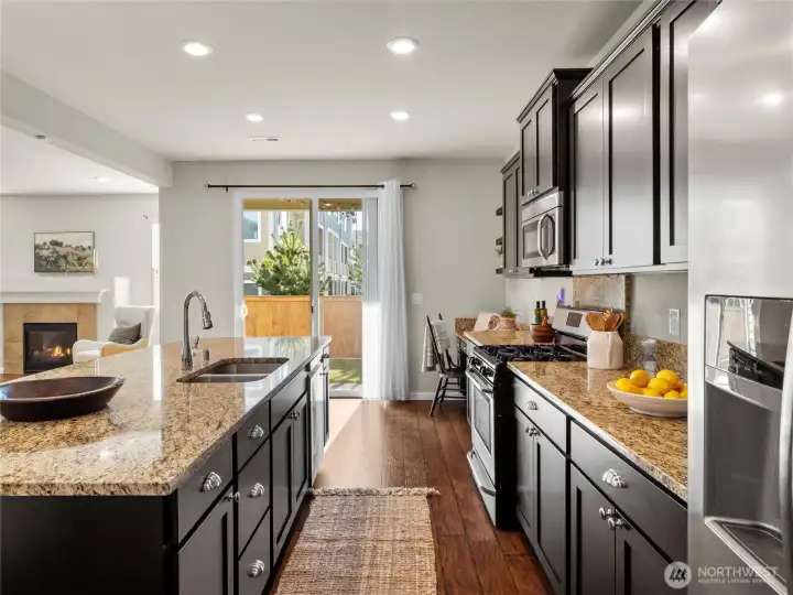 Bright kitchen with backyard access through sliding doors — ideal for everyday living and entertaining.