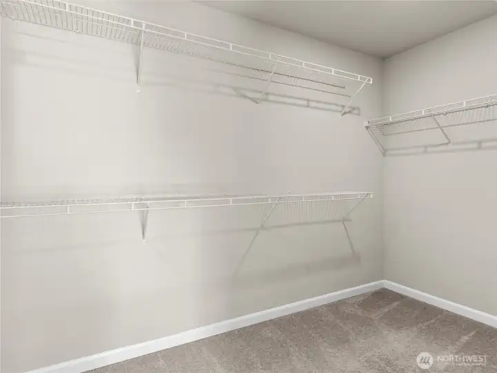 Oversized primary walk-in closet.