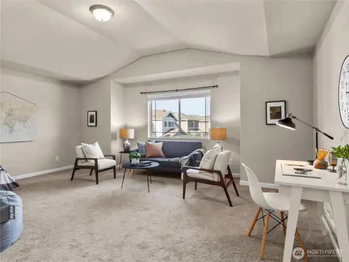 Spacious upstairs bonus room offers flexible living space — great for work, play, or relaxation.
