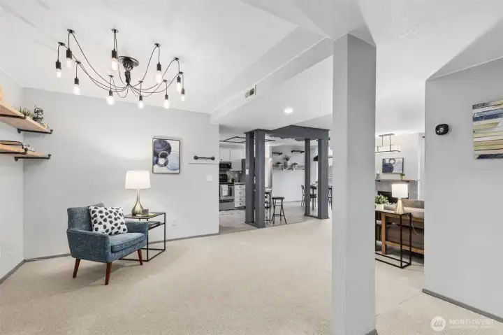 Step into the home onto a tile entry floor, and see a view from the front door that shows the extra large, easy flow great room and now open passage to the kitchen. Upgraded include quality carpeting, tile and more.