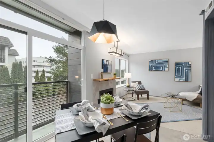 A wide sliding glass door and tall view windows enjoy Southeastern light through the day. The unit offers a serene view of a tall Arbor Vitae landscape barrier that helps with privacy and sits above the back drive to the garages.
