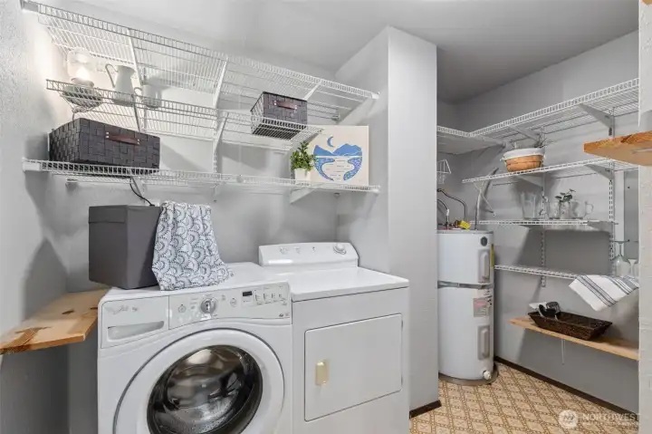 Discover a very hard to find full utility-pantry with loads of built-in storage shelves. A far cry from stackables in a closet that is commonly found in condo living. A very special and useful feature.  Space galore.