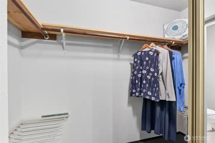 Three walls of closet space wait for your special customization. The pant racks on each side of the closet provide a good start.