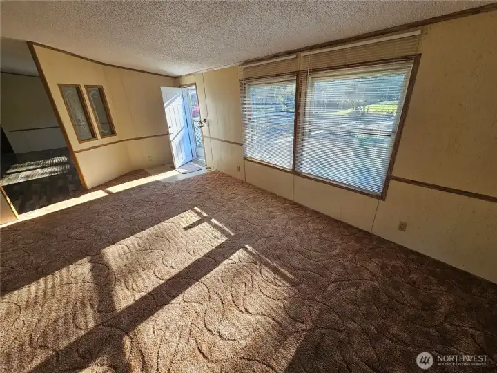 The Livingroom gets filled with natural light in this spacious area connected to the dining room.