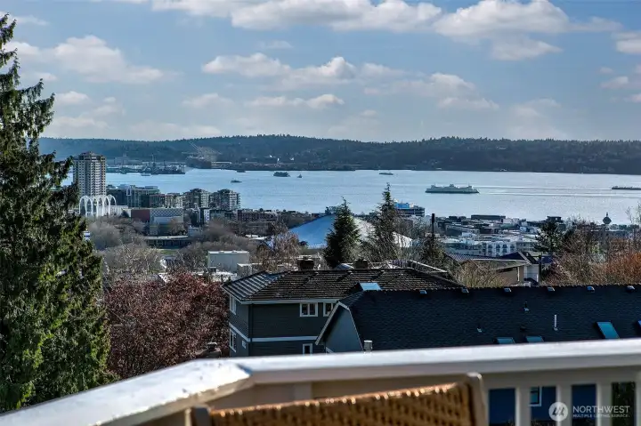 Big Views of Elliott Bay. Great outdoor spaces include decks from living and primary suite, a low maintenance front yard and a ground level sunshine terrace.
