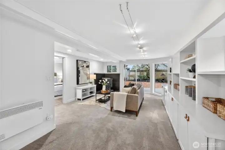 The family room is on the main-level just off the dining area and leads to a large second bedroom and to the backyard.