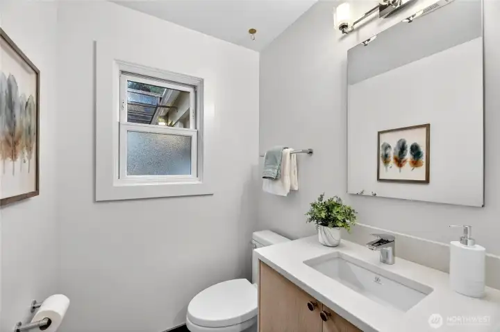 This charming half bath is located on the main floor.