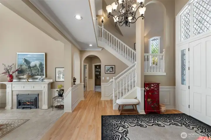 living room on left, front door on right, master bedroom ahead on left, den/office on right