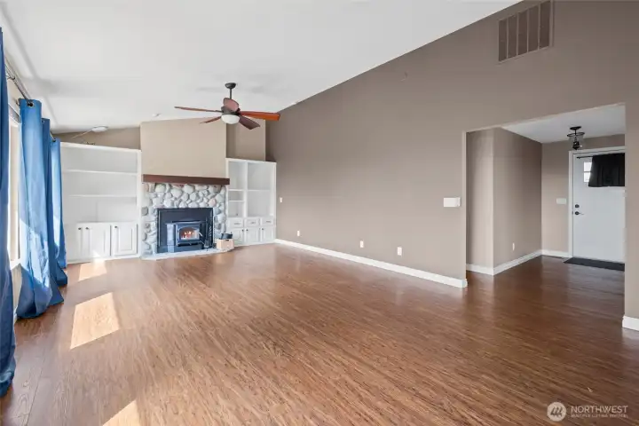 Living room view with foyer & front door entry to right of picture