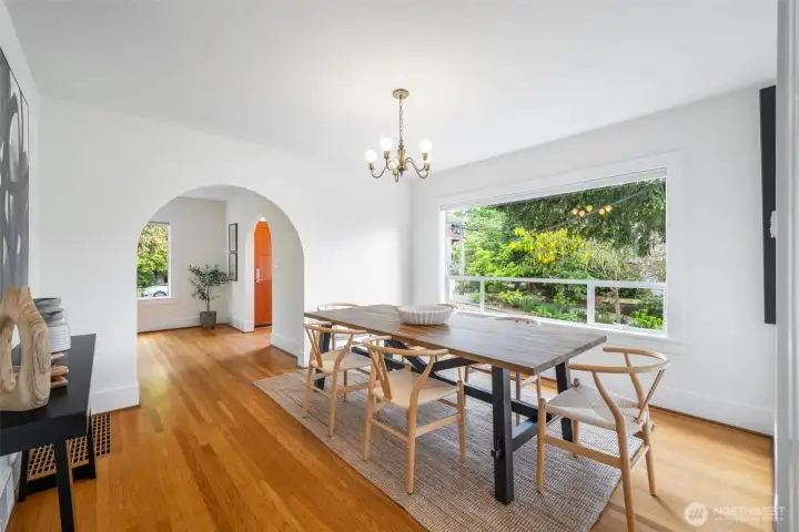 Large formal dining room with lush green views connects the living room and kitchen. Large formal dining room with lush green views connects the living room and kitchen.
