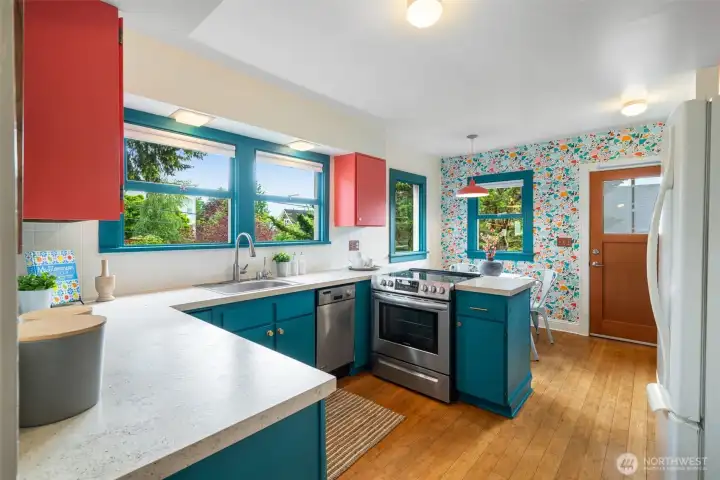 Bright open kitchen with dining nook and direct access to back deck. Bright open kitchen with dining nook and direct access to back deck.