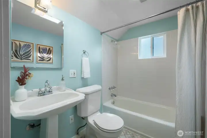 Upstairs full bath has a big skylight (not shown) and window in the shower - so much light throughout this home. Upstairs full bath has a big skylight (not shown) and window in the shower - so much light throughout this home.