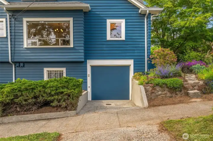 Attached garage and driveway parking pad off the sidewalk. Attached garage and driveway parking pad off the sidewalk.