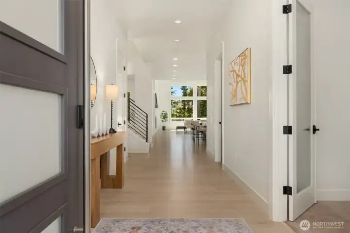 Light-filled and inviting foyer featuring modern flooring, recessed lighting, and clean contemporary design.