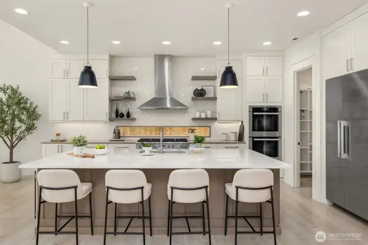Showpiece chef’s kitchen centered around a striking quartz island, perfect for entertaining and everyday living.