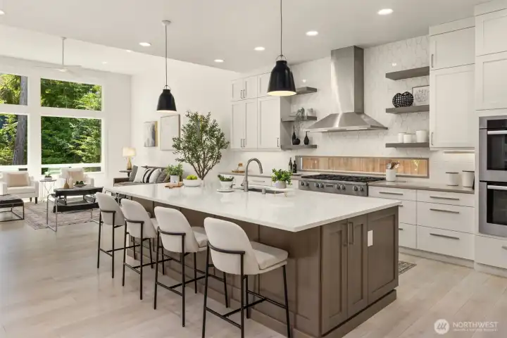 Another view highlighting the stunning chef’s kitchen and its effortless flow into the open-concept living area.