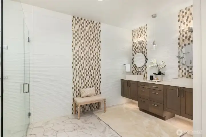 Luxurious primary bath with a soaking tub, dual vanities, and a bright, serene atmosphere.