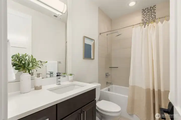 One of two second-floor full bathrooms, offering convenience and functionality.