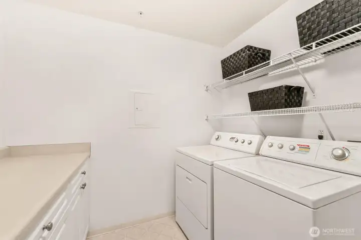 Laundry room has space for storage and folding.